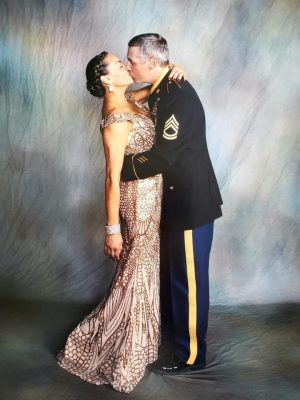 Military couple kissing at a Military ball