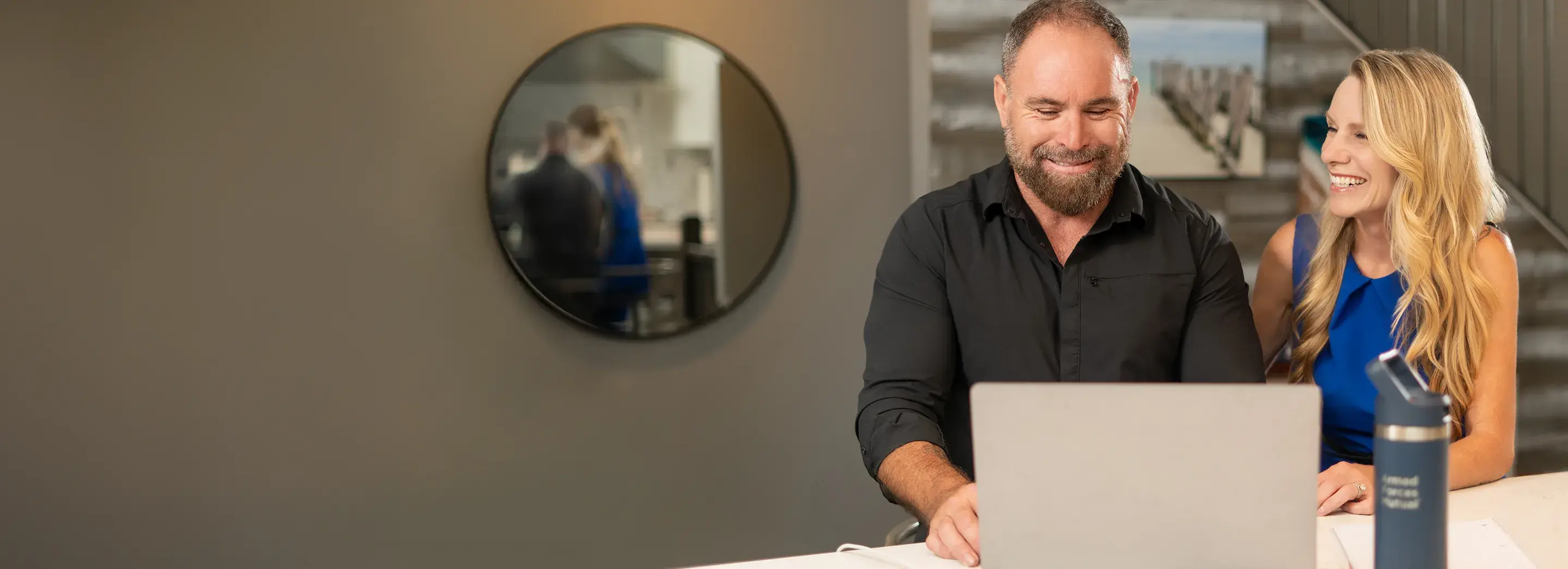 A couple using a laptop together.