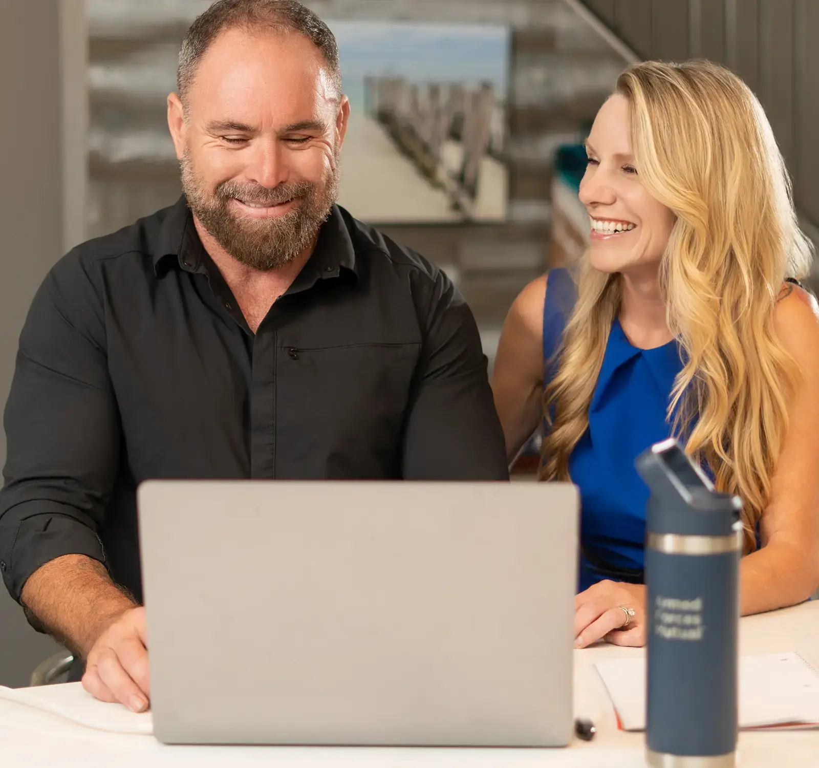 A couple using a laptop together.