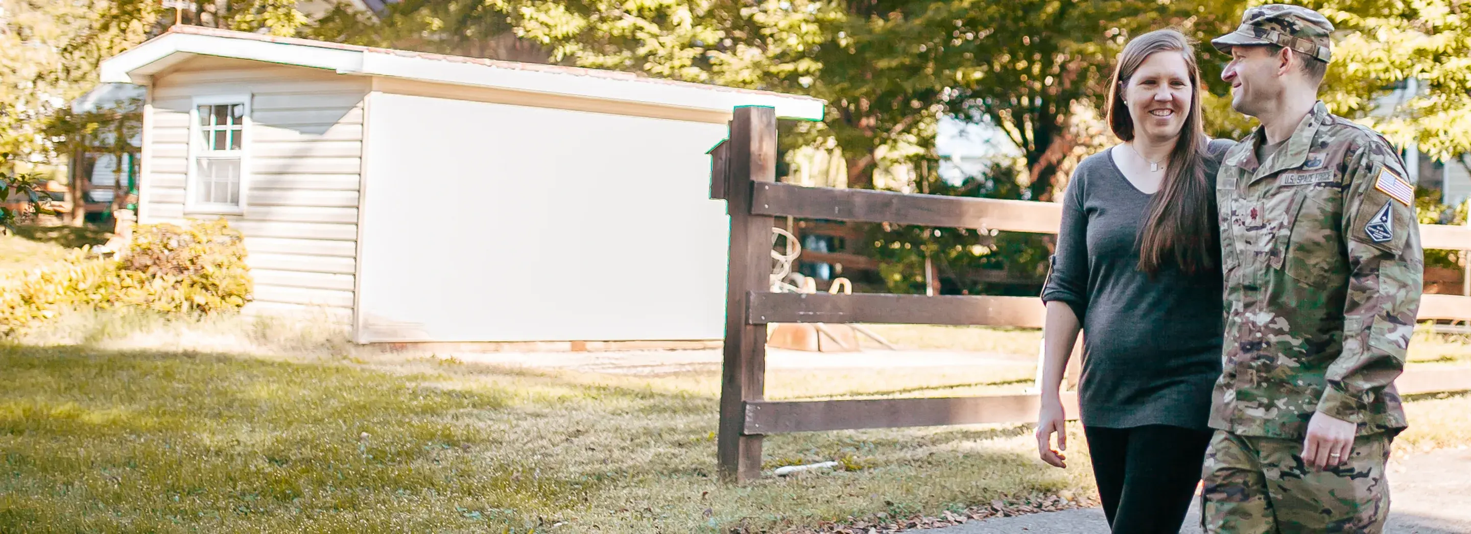 Two people walking on a path.