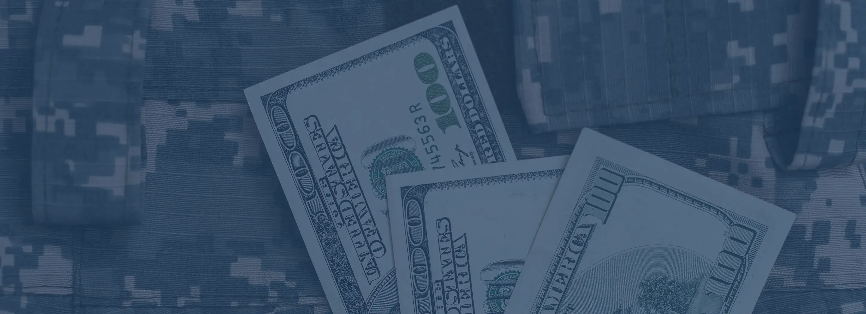 A military pattern with money sitting on top.