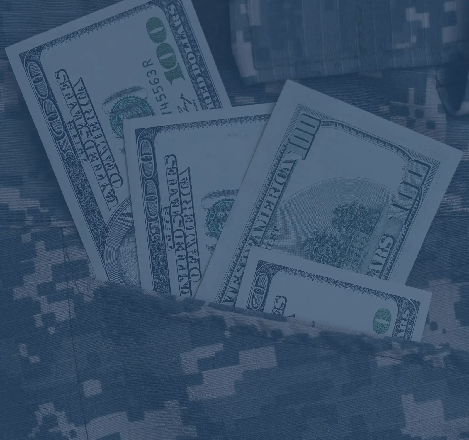 A military pattern with money sitting on top.