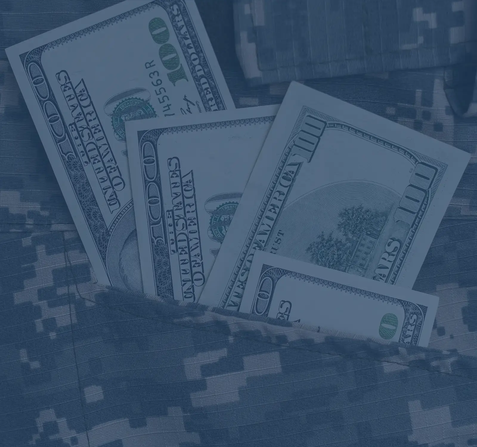 A military pattern with money sitting on top.