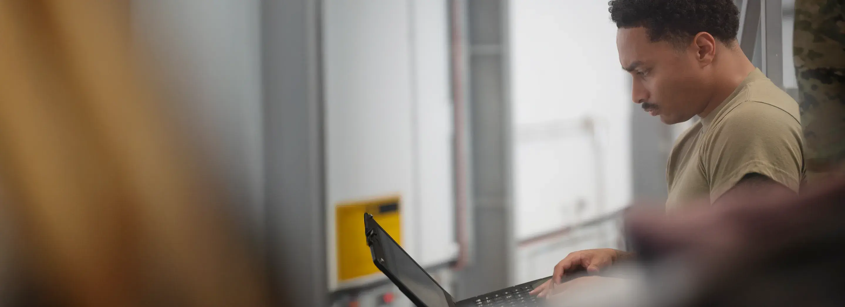 A person using a laptop.