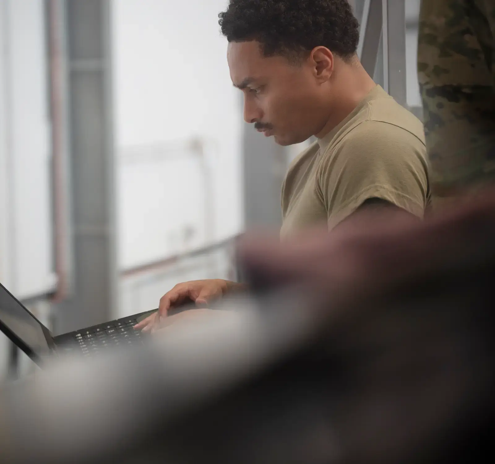 A person using a laptop.