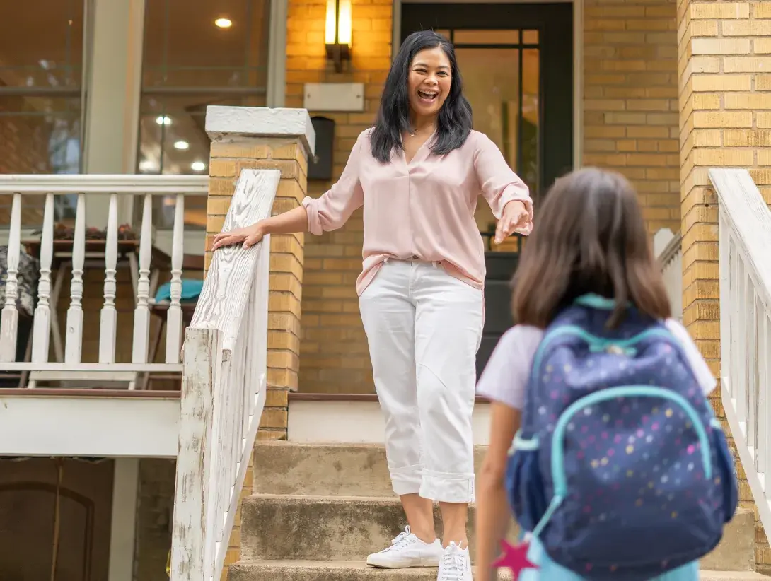 Mother walking down the stairs.