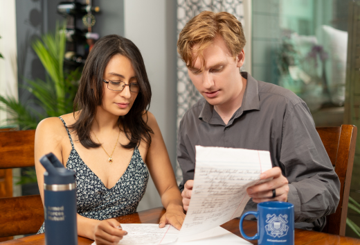 Young military couple looking over documents