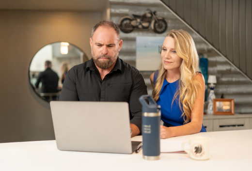 Disabled military couple looking at computer together