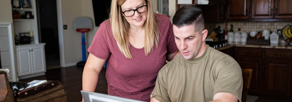 Couple looking at laptop together